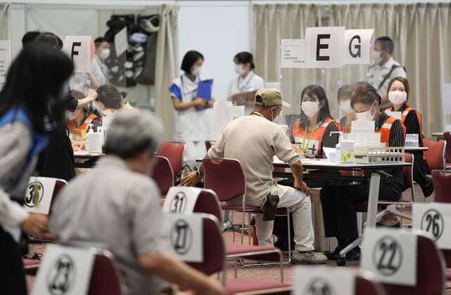 Japan s efforts to accelerate COVID-19 vaccination An elderly person undergoes procedures after getting a COVID-19 vaccine shot at a mass vaccination center in Osaka on June 14, 2021. Two state-run mass vaccination centers in Tokyo and Osaka began administering vaccines to elderly people from around Japan the same day, expanding the target areas from seven prefectures in the Tokyo and Osaka areas, as part of efforts to accelerate Japan s inoculation drive. 