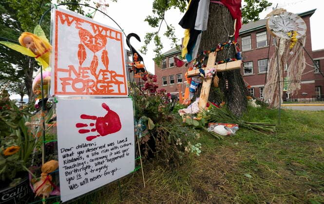 June 13, 2021, Kamloops, BC, Canada: Signs are pictured at a memorial outside the Residential School in Kamloops, B.C., Sunday, June, 13, 2021. The remains of 215 children were discovered buried near the former Kamloops Indian Residential School earlier this month. Kamloops Canada  - ZUMAc35_ 20210613_zaf_c35_085 Copyright: xJonathanxHaywardx