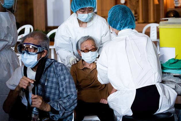 June 15, 2021, Taipei, Taiwan: Health workers administer a dose of AstraZeneca COVID-19 vaccine to an elderly woman..Vaccination session for elderly people over 85 years old begins on Tuesday in Taipei, Taiwan on June 15, 2021. Taipei Taiwan - ZUMAs197 20210615_zaa_s197_016 Copyright: xAnnabellexChihx