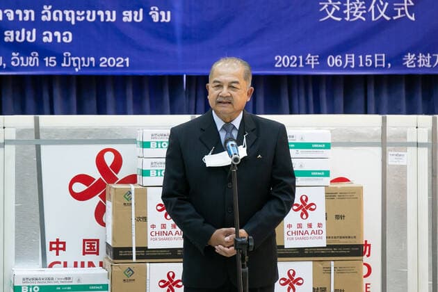 (210615) -- VIENTIANE, June 15, 2021 -- Lao People s Revolutionary Party (LPRP) central committee politburo member, Deputy Prime Minister and Chairman of the National Taskforce Committee for COVID-19 Prevention and Control Kikeo Khaykhamphithoune speaks during the handover ceremony of China-donated COVID-19 vaccines in Vientiane, Laos, on June 15, 2021. A batch of Chinese government-donated Sinopharm COVID-19 vaccines arrived at Wattay International Airport in Laos on Monday with a handover ceremony held upon their arrival. (Photo by Kaikeo Saiyasane Xinhua) LAOS-VIENTIANE-CHINA-COVID-19-VACCINE-HANDOVER ZhangxJianhua 