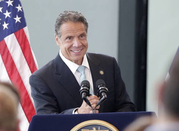 New York Gov. Andrew Cuomo smiles when he arrives for his speech where he goes on to make an official announcement that New York State has officially lifted all COVID restrictions and lockdowns at One World Trade Center in New York City on Tuesday, June 15, 2021.  NYP20210615108 JohnxAngelillo