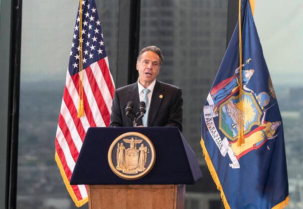 New York: Governor Cuomo Announces COVID-19 Restrictions Lifted Governor Cuomo announced COVID-19 restrictions lifted as 70% of adult New Yorkers have received first dose of vaccine at One World Trade Center. Governor praised all New Yorkers for doing their parts during pandemic. Governor especially lauded essential workers and presented awards to those who carried New York State through the COVID-19 pandemic. Governor said that mask requirement for unvaccinated individuals and in certain settings (e.g., large-scale indoor event venues, pre-K to grade 12 schools, public transit, homeless shelters, correctional facilities, nursing homes and health care settings per CDC guidance) will stay in place. New York New York United States One World Copyright: LevxRadin