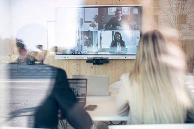 Business professionals on video conference meeting in office model released Symbolfoto property released JSRF01508