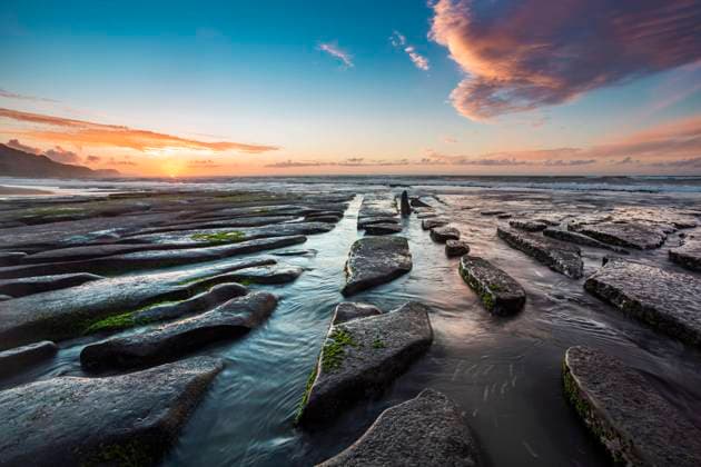 New Zealand, South Island, Rocky coast at sunset WVF01996