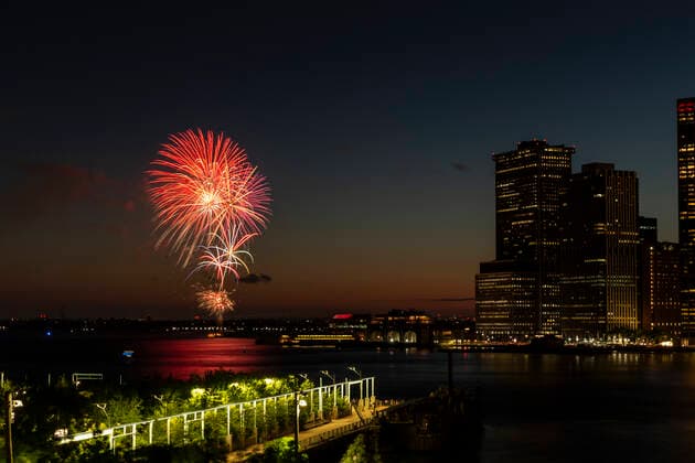Fireworks display in NYC on the day state lifted pandemic restrictions Fireworks lit evening skies in celebration of reaching 70 percent of New York adults receiving their first dose of the COVID-19 vaccine on New York Harbor. Governor Andrew Cuomo ordered fireworks display to celebrate lifting restriction and to recognize essential workers for their hard work and to remember those we lost. New York New York United States Copyright: LevxRadin