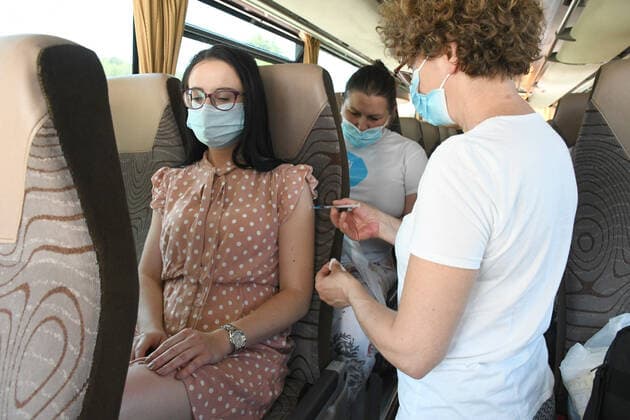 Croatia Coronavirus vaccine bus A woman is being vaccinated at Coronavirus vaccine bus in Bjelovar, Croatia on June 17, 2021. Coronavirus vaccine bus travelling around city of Bjelovar and suburbs offering a walk-in vaccine service. DamirxSpehar PIXSELL