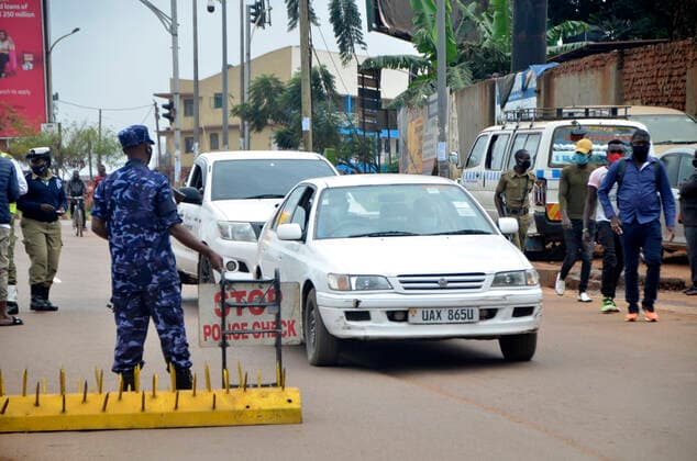 (210620) -- KAMPALA, June 20, 2021 -- A security guard works at a checkpoint in Kampala, Uganda, June 19, 2021. Ugandan President Yoweri Museveni on Friday announced a string of measures aimed at containing the rapid spread of the novel coronavirus as the country is experiencing a second wave. (Photo by Xinhua) UGANDA-KAMPALA-ANTI-COVID-19-MEASURES NicholasxKajoba 