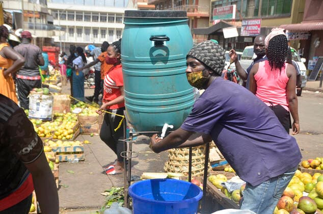 (210620) -- KAMPALA, June 20, 2021 -- A man washes his hands at the entrance of a market in Kampala, Uganda, on June 20, 2021. Ugandan President Yoweri Museveni on Friday announced a string of measures aimed at containing the rapid spread of the novel coronavirus as the country is experiencing a second wave. (Photo by Xinhua) UGANDA-KAMPALA-MARKET-COVID-19-MEASURES NicholasxKajoba 