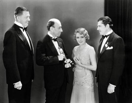 Mary Pickford receives The Best Actress Oscar for Coquette. The ceremony was held on April 3, 1930, at an awards banquet at the Cocoanut Grove in the Ambassador Hotel in Los Angeles. Pictured here with Pickford, Hans Kraly, William C. De Mille and Warner Baxter. File Reference 34145-277THA Hollywood CA USA  Copyright: xCinemaxLegacyxCollection ThexHollywoodxArchivex 34145277THA