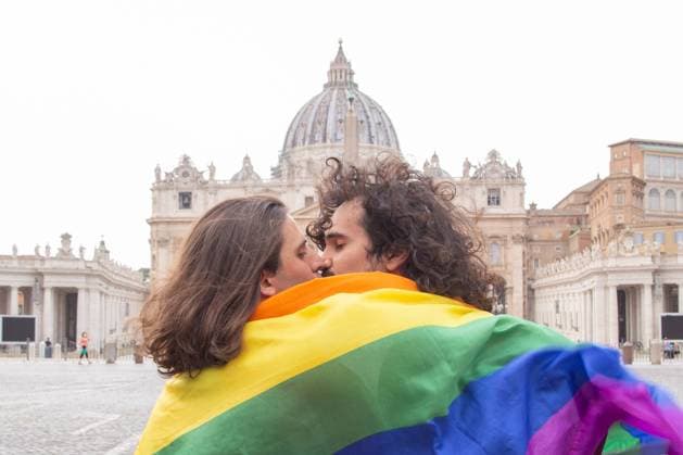 Italy: Protest of LGBT activists in St. Peter s Square Two activists of LGBT community of Rome kiss in front of St. Peter s Basilica during protest Two activists from LGBT community of Rome organized a protest blitz with signs and a LGBT flag in front of St. Peter s Basilica to protest against Vatican s interference on the approval of Zan law decree against homophobia. One of two activists is Andrea Maccarrone, former president of Mario Mieli Homosexual Culture Club. Rome Italy St Peter s Square Copyright: MatteoxNardone