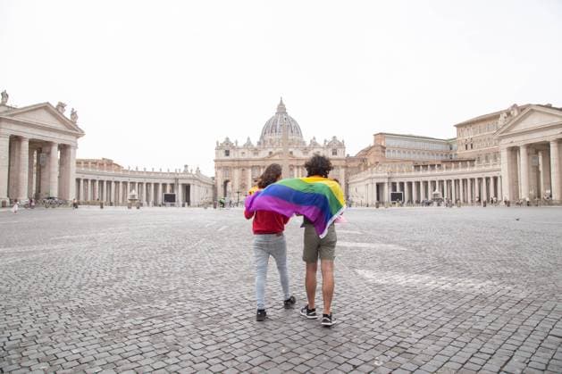 Italy: Protest of LGBT activists in St. Peter s Square Two LGBT activists walk towards St. Peter s basilica with LGBT flag Two activists from LGBT community of Rome organized a protest blitz with signs and a LGBT flag in front of St. Peter s Basilica to protest against Vatican s interference on the approval of Zan law decree against homophobia. One of two activists is Andrea Maccarrone, former president of Mario Mieli Homosexual Culture Club. Rome Italy St Peter s Square Copyright: MatteoxNardone