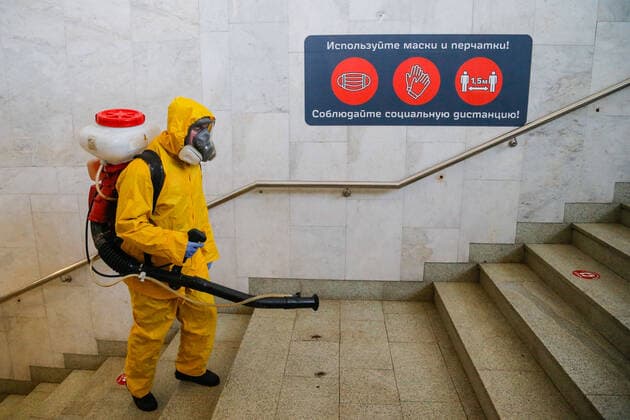 (210624) -- MOSCOW, June 24, 2021 -- A municipal employee wearing a protective suit disinfects a railway station in Moscow, Russia, on June 24, 2021. Russia logged 20,182 new coronavirus infections over the past 24 hours, the highest daily increase since Jan. 24, taking the nationwide tally to 5,388,695, the official monitoring and response center said Thursday. (Photo by Xinhua) RUSSIA-MOSCOW-COVID-19-DISINFECTION AlexanderxZemlianichenkoxJr