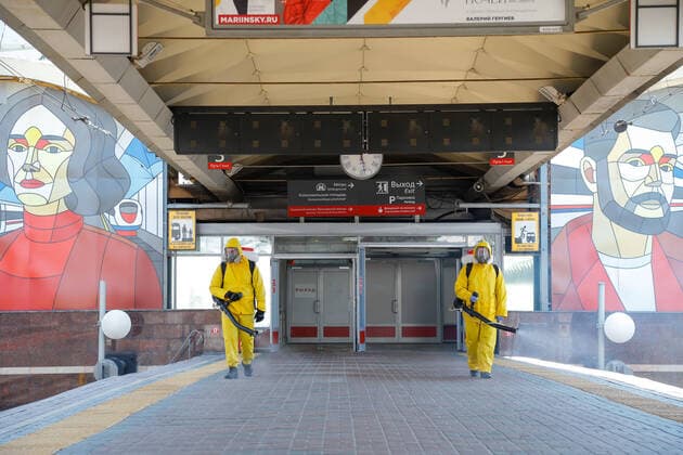 (210624) -- MOSCOW, June 24, 2021 -- Municipal employees wearing protective suits disinfect a railway station in Moscow, Russia, on June 24, 2021. Russia logged 20,182 new coronavirus infections over the past 24 hours, the highest daily increase since Jan. 24, taking the nationwide tally to 5,388,695, the official monitoring and response center said Thursday. (Photo by Xinhua) RUSSIA-MOSCOW-COVID-19-DISINFECTION AlexanderxZemlianichenkoxJr