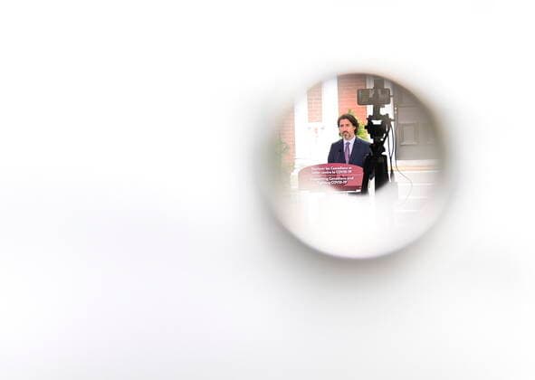 June 25, 2021, Ottawa, on, Canada: Prime Minister Justin Trudeau is photographed through a hole in a tarp tent as he holds a press conference at Rideau Cottage in Ottawa on Friday, June 25, 2021. Ottawa Canada  - ZUMAc35_ 20210625_zaf_c35_015 Copyright: xSeanxKilpatrickx
