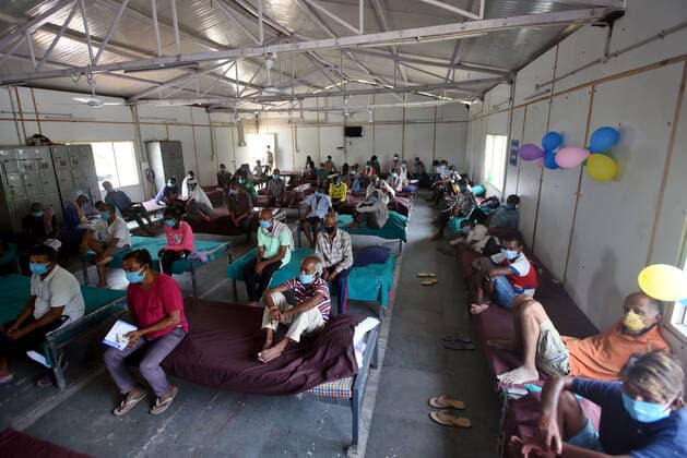 New Delhi, India - June 25, 2021: Homeless people waiting to get inoculated against Covid-19 during a vaccination drive at a shelter, near Kashmere Gate, in New Delhi, India, on Friday, June 25, 2021. (Photo by Amal KS Hindustan Times) Covid Vaccination Camp For Homeless