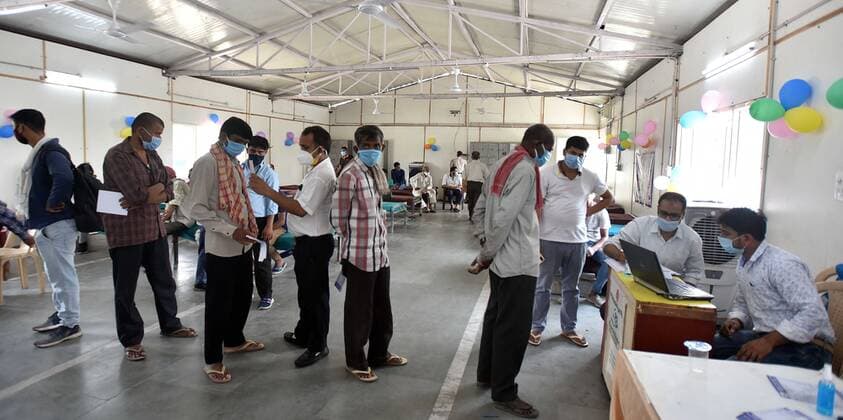 NEW DELHI, INDIA - JUNE 25: Homeless people Lineup for registration for a shot of Covid vaccine during the First Vaccination camp for homeless is starting at Yamuna Pushta Night Shelter near Nigam Bodh Ghat opposite Hanuman Mandir on June 25, 2021 in New Delhi, India. (Photo by Sonu Mehta Hindustan Times) Covid Vaccination Camp For Homeless