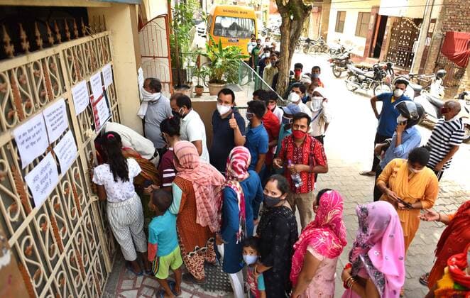 GURUGRAM, INDIA - JUNE 25: People, not adhering to social distancing norms, wait in queues to receive Covid-19 dose, at a vaccination centre, on June 25, 2021 in Gurugram, India. (Photo by Vipin Kumar Hindustan Times) COVID-19 Vaccination Drive