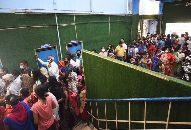 GURUGRAM, INDIA - JUNE 25: People, not adhering to social distancing norms, wait in queues to receive Covid-19 dose, at a vaccination centre, on June 25, 2021 in Gurugram, India. (Photo by Vipin Kumar Hindustan Times) COVID-19 Vaccination Drive