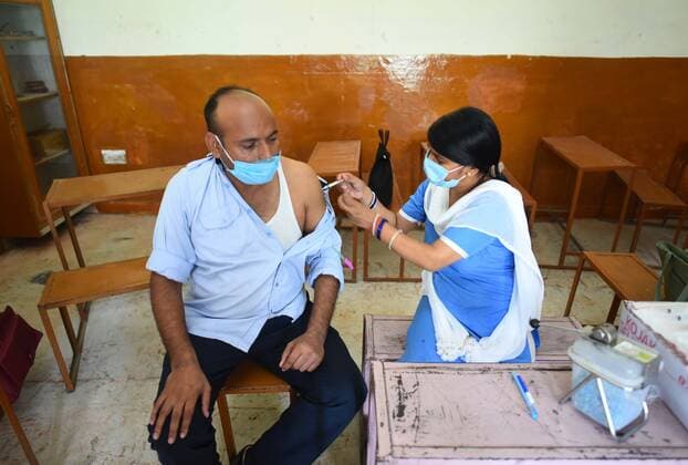 GURUGRAM, INDIA - JUNE 25: A beneficiary receives a dose of COVID-19 vaccine at a vaccination centre, on June 25, 2021 in Gurugram, India. (Photo by Vipin Kumar Hindustan Times) COVID-19 Vaccination Drive