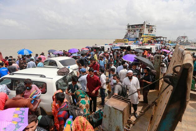 June 26, 2021, Shimulia, Munshiganj, Bangladesh: Two days ahead of the seven-day nationwide shutdown, thousands of people overcrowded the Shimulia ferry terminal in their efforts to get back to their homes, Shimulia, Munshiganj, June 26, 2021. People were seen flocking the Shimulia-Banglabazar ferry ghat and crossing the river since morning ignoring health safety protocols. Shimulia Bangladesh - ZUMAd117 20210626_zap_d117_008 Copyright: xSuvraxKantixDasx