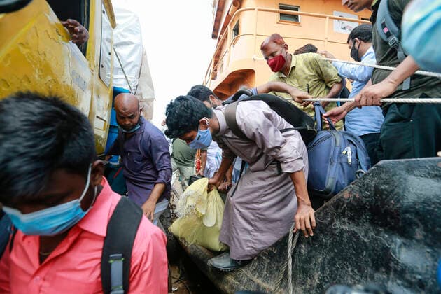 June 26, 2021, Shimulia, Munshiganj, Bangladesh: Two days ahead of the seven-day nationwide shutdown, thousands of people overcrowded the Shimulia ferry terminal in their efforts to get back to their homes, Shimulia, Munshiganj, June 26, 2021. People were seen flocking the Shimulia-Banglabazar ferry ghat and crossing the river since morning ignoring health safety protocols. Shimulia Bangladesh - ZUMAd117 20210626_zap_d117_015 Copyright: xSuvraxKantixDasx