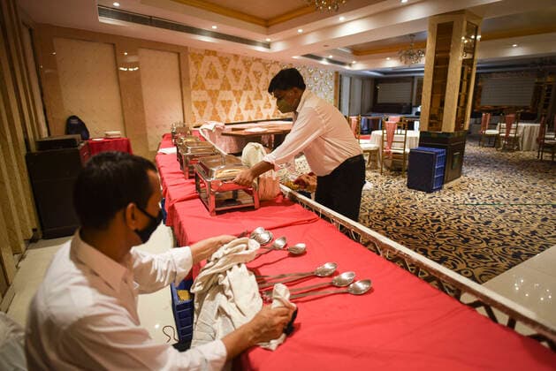 NEW DELHI, INDIA JUNE 27: Preparations underway at Pancshila Rendezvous Banquets in Malviya Nagar ahead of its reopening tomorrow, on June 27, 2021 in New Delhi, India. Gyms and yoga centres have been allowed to reopen in Delhi from Monday at 50% capacity, an official government order said. Banquet halls, marriage halls, and hotels have also been permitted to host weddings, but the number of guests has been capped at 50, the order said. (Photo by Sanchit Khanna Hindustan Times ) Delhi Unlock 5: Gyms, Banquet Halls, Hotels To Open From Monday