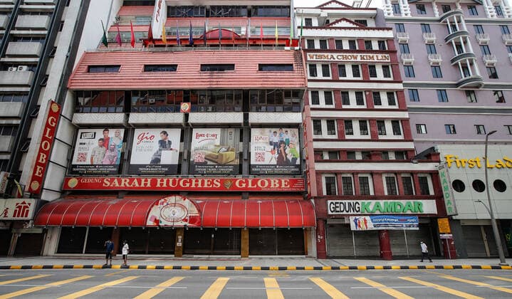 June 27, 2021, Kuala Lumpur, Malaysia: People seen wearing masks on a deserted street street in downtown Kuala Lumpur..Malaysia government announced the one month full lockdown which is due on Monday will be extended due to the daily high number of coronavirus infections cases reported. Kuala Lumpur Malaysia - ZUMAs197 20210627_zaa_s197_079 Copyright: xWongxFokxLoyx