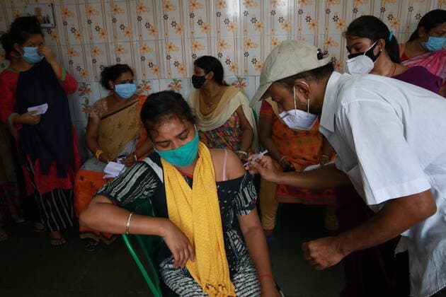 India: Vaccination for sex workers A health worker inoculates a Sex worker person with a dose of the Covishield vaccine against the Covid-19 coronavirus at Red Light area a vaccination centre in Kolkata on June 28,2021. Kolkata West Bengal India Copyright: DipaxChakraborty