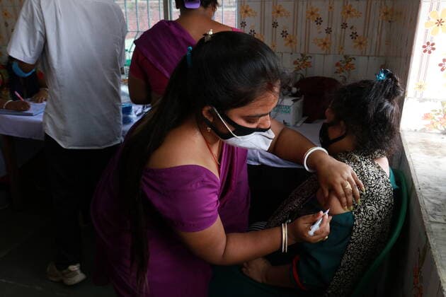 India: Vaccination for sex workers A health worker inoculates a Sex worker person with a dose of the Covishield vaccine against the Covid-19 coronavirus at Red Light area a vaccination centre in Kolkata on June 28,2021. Kolkata West Bengal India Copyright: DipaxChakraborty