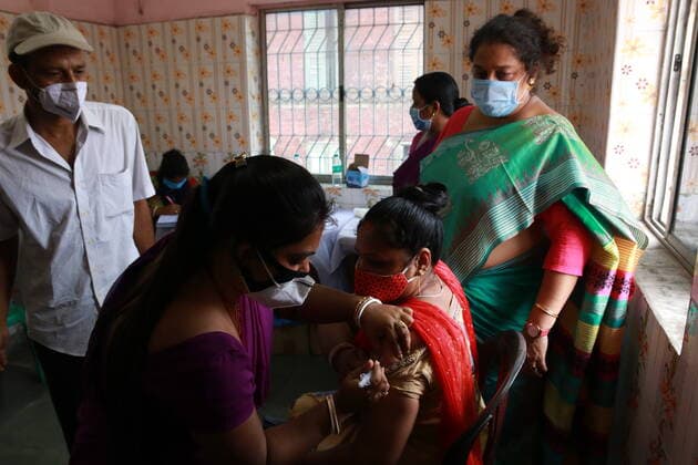India: Vaccination for sex workers A health worker inoculates a Sex worker person with a dose of the Covishield vaccine against the Covid-19 coronavirus at Red Light area a vaccination centre in Kolkata on June 28,2021. Kolkata West Bengal India Copyright: DipaxChakraborty