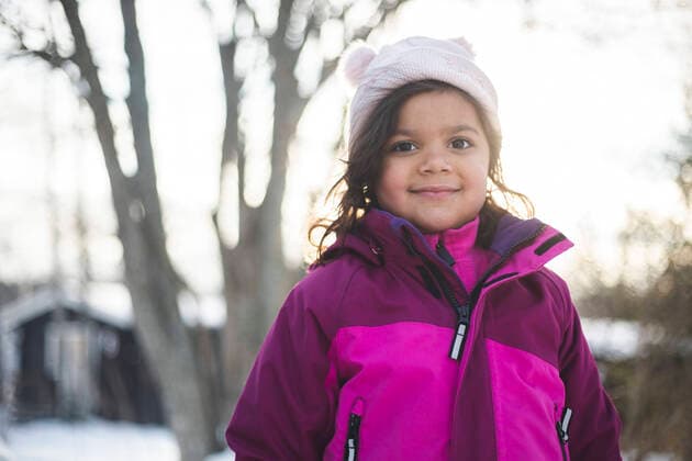 IMAGO Creative: Wintersport, Mode Portrait of smiling girl wearing warm clothing during winter Sweden, Hellas, model released Copyright: xMaskotx , MA87804