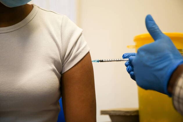 June 29, 2021, London, United Kingdom: A NHS health worker administers a dose of Pfizer Covid-19 vaccine to a woman, at a vaccination centre in London. London United Kingdom - ZUMAs197 20210629_zab_s197_004 Copyright: xDinendraxHariax
