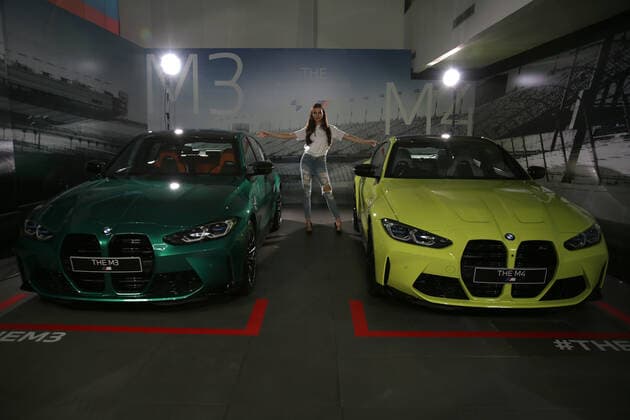 New Bmw M3 And M4 Competition Launch In Jakarta Models pose between The All New BMW M3 and M4 Competition cars after a virtual launch in Jakarta, Indonesia on June 30, 2021. BMW Indonesia launched the two cars with three new colors, a high-performance 510hp 650Nm engine, and an expressive design as well as an eight-speed BMW M Steptronic transmission with Drivelogic and a series of innovative technologies developed by BMW M that will be offered for The new BMW M3 Competition with the price of IDR 2,059 billion off the road, while the New BMW M4 Competition Coupe will be offered at a price of IDR 2.119 billion off the road. Jakarta Indonesia roszandi-notitle210630_npqKS  Copyright: xDasrilxRoszandix