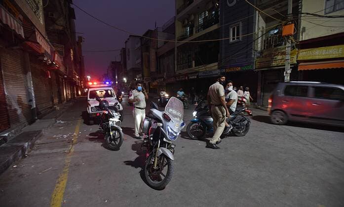 NEW DELHI, INDIA - JUNE 30: Police personnel ikeeping watch in Laxmi Nagar Market after an order for the closure of the market and adjoining areas until July 5 over violation of Covid-19 safety protocols on June 30, 2021 in New Delhi, India. The government has said there was a heavy footfall in the Laxmi Nagar market, so it has been closed till July 5. (Photo by Raj K Raj Hindustan Times) Laxmi Nagar Market In Delhi Closed Over Covid-19 Protocol Violations