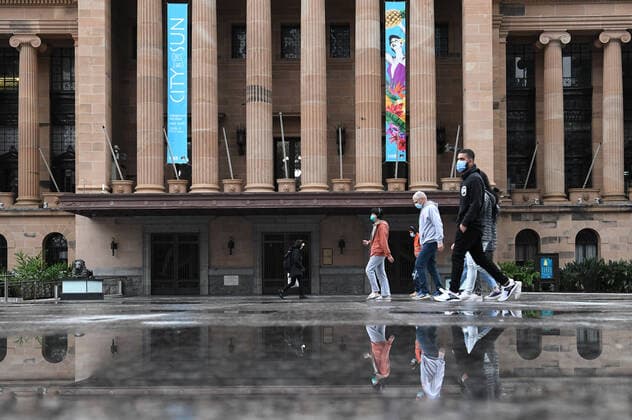 QLD CORONAVIRUS COVID19, People wearing protective face masks are seen walking through King George Square during lockdown in Brisbane, Thursday, July 1, 2021. Premier Annastacia Palaszczuk has placed south-east Queensland, Townsville, Palm Island and Magnetic Island into a 3-day lockdown. ( NO ARCHIVING, EDITORIAL USE ONLY, NO USE IN BOOKS WITHOUT CONSENT BRISBANE QLD AUSTRALIA  Copyright: xDARRENxENGLANDx 20210701001553964720