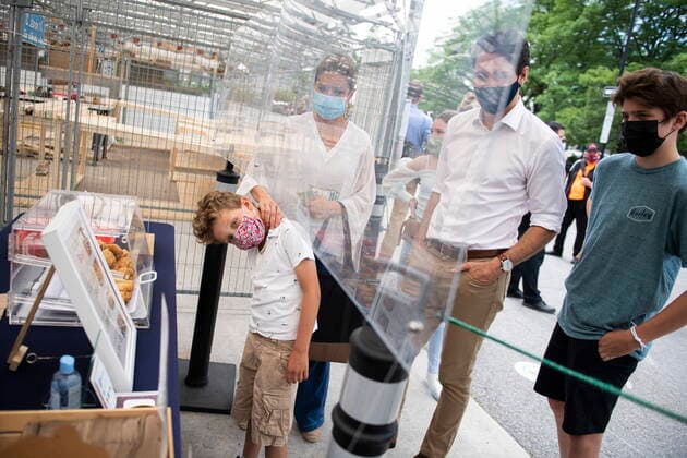 July 1, 2021, Ottawa, on, Canada: Sophie Gregoire Trudeau pulls her son Hadrien Trudeau from behind a plexiglass barrier as Prime Minister Justin Trudeau and his family order gyoza for lunch at a vendor at the Parkdale Public Market in Ottawa on Canada Day, Thursday, July 1, 2021. Ottawa Canada  - ZUMAc35_ 20210701_zaf_c35_038 Copyright: xJustinxTangx