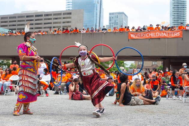 July 1, 2021, Toronto, on, Canada: Eight-year-old hoop dancer Emilee Ann Pitawanakwat plays as people listen to a speaker following an Every Child Matters walk, in Toronto, on Thursday July 1, 2021 to honour former residential school students. Toronto Canada  - ZUMAc35_ 20210701_zaf_c35_056 Copyright: xChrisxYoungx