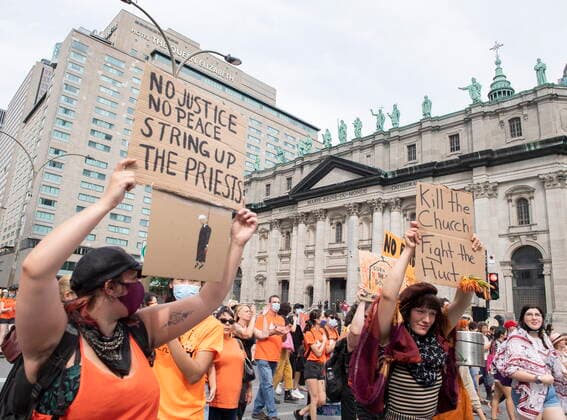 July 1, 2021, Montreal, PQ, Canada: People hold up signs as they pass by Mary Queen of the World Cathedral during a gathering and march to honour Indigenous children, denounce genocide and demand justice for residential school victims in Montreal, Thursday, July 1, 2021. Montreal Canada  - ZUMAc35_ 20210701_zaf_c35_127 Copyright: xGrahamxHughesx