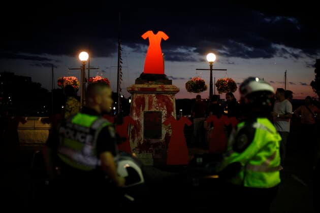 July 1, 2021, Victoria, BC, Canada: Victoria Police stand by following the removal of the statue of English explorer Capt. James Cook, which was tossed into the inner harbour and replaced with red hand prints and a red dress memorial in honour of missing and murdered Indigenous women and girls, in Victoria, Thursday, July 1, 2021. Victoria Canada  - ZUMAc35_ 20210701_zaf_c35_299 Copyright: xChadxHipolitox