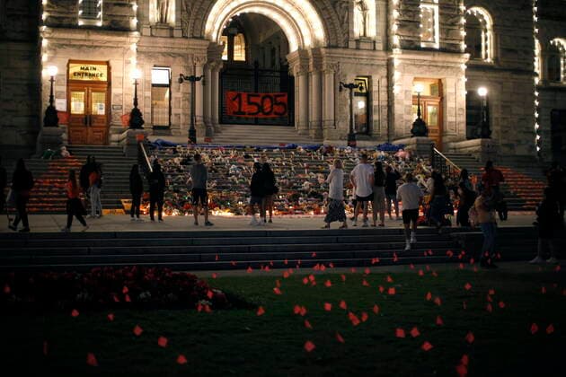 July 1, 2021, Victoria, BC, Canada: People pay respects to the victims of Canada s residential school system amid shoes, teddy bears, orange shirts and other tributes placed on the steps outside the legislature, in Victoria, Thursday, July 1, 2021. Victoria Canada  - ZUMAc35_ 20210701_zaf_c35_302 Copyright: xChadxHipolitox