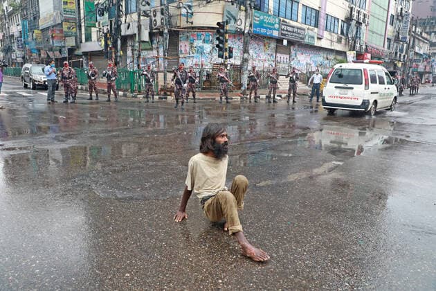 July 2, 2021, Dhaka, Dhaka, Bangladesh: 02, July, 2021 A physical hadicap man crossing road during Border Guard of Bangladesh (BGB) set check point in a road in Dhaka during Strict lockdown in Bangladesh Dhaka Bangladesh - ZUMAr338 20210702_zip_r338_011 Copyright: xHarun-Or-Rashidx