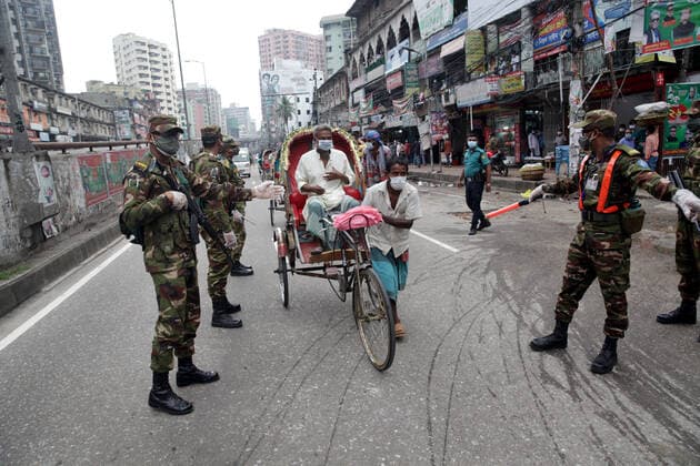 Jul 2, 2021 - Dhaka, Bangladesh - Army personnel limit people s movement from a checkpoint set up at Dhaka nationwide district lockdown to curb the coronavirus pandemic In Bangladesh. Dhaka Bangladesh  - ZUMAr336 20210702_int_r336_016 Copyright: xHabiburxRahmanx