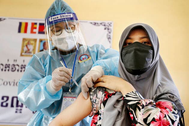 (210703) -- PHNOM PENH, July 3, 2021 -- A woman receives a dose of COVID-19 vaccine at an inoculation site in Phnom Penh, Cambodia on July 2, 2021. (Photo by Xinhua) CAMBODIA-PHNOM PENH-COVID-19-VACCINATION Phearum 