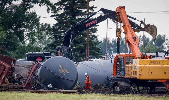 July 3, 2021, Blackfalds, ab, Canada: Crews work to clean up a spill after the derailment of a 20-car train carrying tar sand and lumber near Blackfalds, Alta., Saturday, July 3, 2021. Blackfalds Canada  - ZUMAc35_ 20210703_zaf_c35_003 Copyright: xJeffxMcintoshx