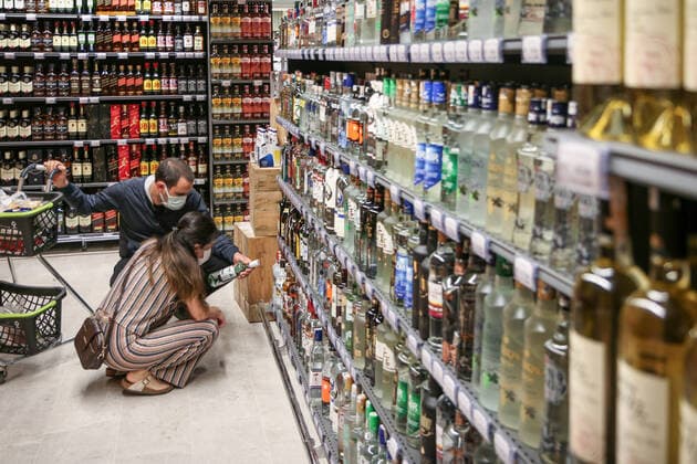 July 3, 2021, Ankara, Turkey: A couple wearing facemasks as a precaution against the spread of covi-19 seen buying alcohol at the convenience store..President of the Republic of Turkey, Recep Tayyip Erdogan, announced his decision to normalize after the cabinet meeting he held on June 21. As of July 1, while the weekend curfew was lifted in Turkey, many restrictions were lifted due to the decrease in COVID-19 cases, and then normal life was returned. Ankara Turkey - ZUMAs197 20210703_zaa_s197_346 Copyright: xTunahanxTurhanx