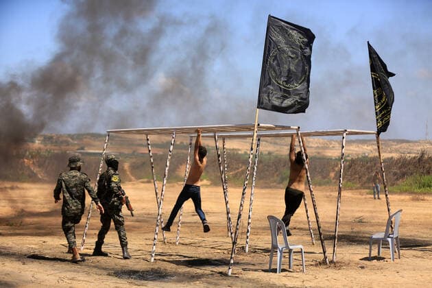 July 4, 2021, Gaza city, Gaza Strip, Palestinian Territory: Young Palestinians take part in a military summer camp organised by the Islamic Jihad Movement, in Gaza City on July 04, 2021 Gaza city Palestinian Territory - ZUMAap3_ 20210704_zaf_ap3_109 Copyright: xDawoudxAboxAlkasx