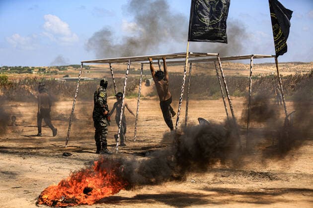 July 4, 2021, Gaza city, Gaza Strip, Palestinian Territory: Young Palestinians take part in a military summer camp organised by the Islamic Jihad Movement, in Gaza City on July 04, 2021 Gaza city Palestinian Territory - ZUMAap3_ 20210704_zaf_ap3_119 Copyright: xDawoudxAboxAlkasx