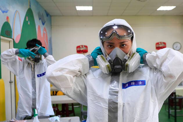 July 5, 2021, Taipei, Taipei, Taiwan: Chemical troop officers put on a personal protective equipment before disinfecting a vaccination centre in Taipei, as the island is combating an outbreak with a increasing number of infections and deaths of Covid-19. The island has previously reported cases of Covid delta variant while facing shortage of vaccines that a nationwide level 3 Covid-19 alert has been extended. Taipei Taiwan - ZUMAs313 20210705_zip_s313_001 Copyright: xDanielxCengxShou-Yix