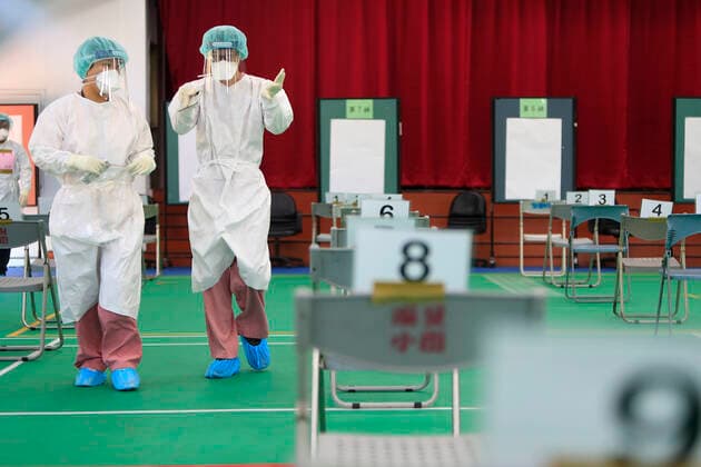 July 5, 2021, Taipei, Taipei, Taiwan: Medical workers wearing a personal protective equipment seen at a vaccination centre in Taipei, as the island is combating an outbreak with a increasing number of infections and deaths of Covid-19. The island has previously reported cases of Covid delta variant while facing shortage of vaccines that a nationwide level 3 Covid-19 alert has been extended. Taipei Taiwan - ZUMAs313 20210705_zip_s313_007 Copyright: xDanielxCengxShou-Yix