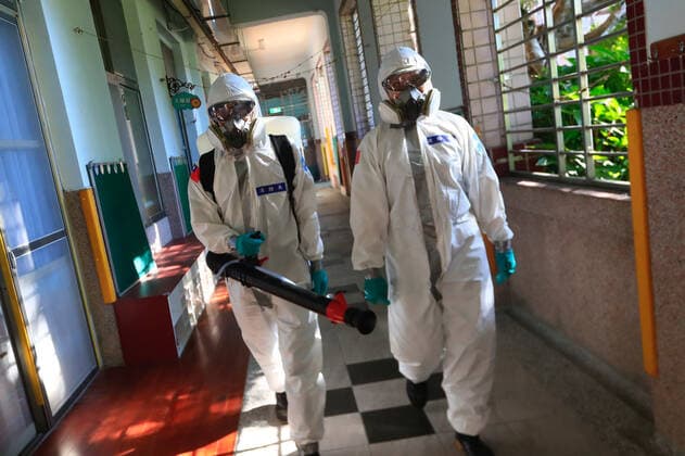 July 5, 2021, Taipei, Taipei, Taiwan: Chemical troop officers with personal protective equipment disinfect a vaccination centre in Taipei, as the island is combating an outbreak with a increasing number of infections and deaths of Covid-19. The island has previously reported cases of Covid delta variant while facing shortage of vaccines that a nationwide level 3 Covid-19 alert has been extended. Taipei Taiwan - ZUMAs313 20210705_zip_s313_019 Copyright: xDanielxCengxShou-Yix